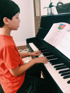 Boy playing piano